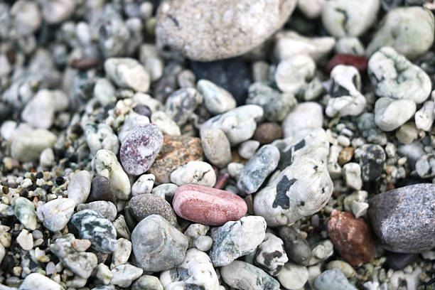istock Close-up of colorful, naturally polished pebbles with unique patterns and textures, creating an organic and calming composition ideal for backgrounds, nature themes, and design projects. 2246888202