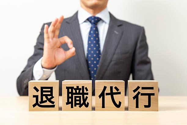 istock A businessman making an OK pose with a block that says 
