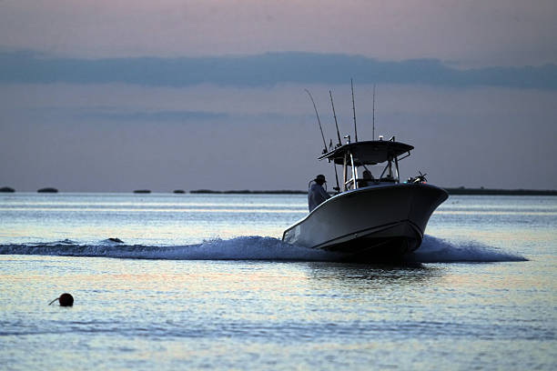 Fishing boar navigating Sunny Isles skyline, Florida