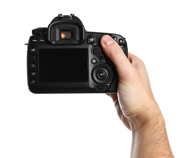 istock Photographer holding modern camera on white background, closeup 2246893160