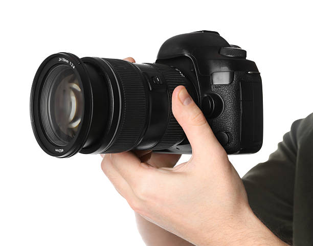 istock Photographer holding modern camera on white background, closeup 2246893163
