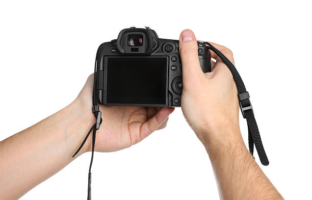 istock Photographer holding modern camera on white background, closeup 2246893170