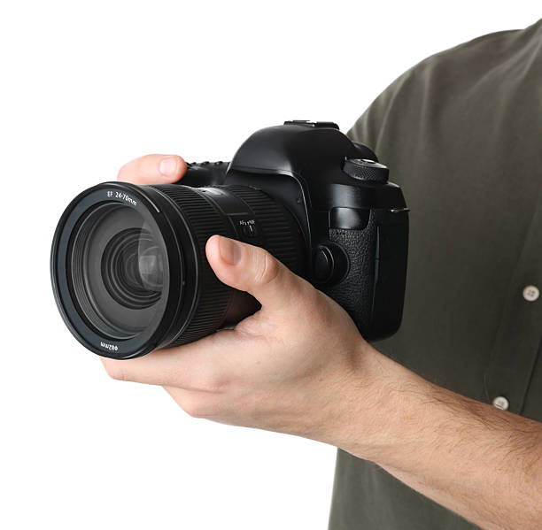 istock Photographer holding modern camera on white background, closeup 2246893192