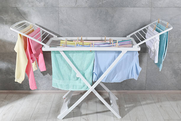 istock Drying rack with fresh clean laundry at home 2246896391