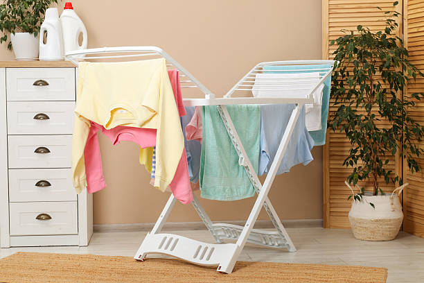 istock Drying rack with fresh clean laundry at home 2246896414