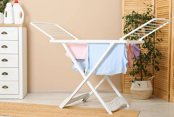 istock Drying rack with fresh clean laundry at home 2246896417