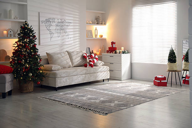 istock Beautiful Christmas tree and other decor in spacious room. Festive interior design 2246897013
