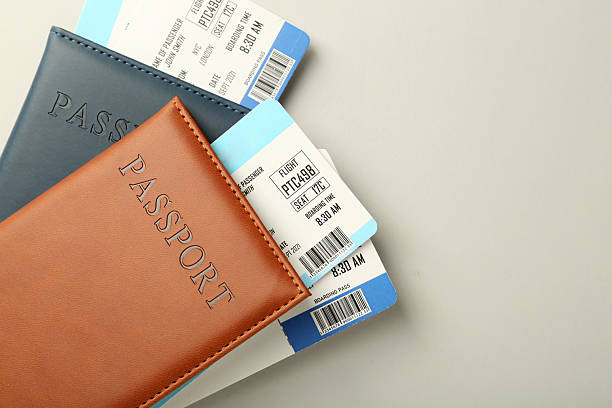 istock Passports with tickets on light background, top view. Space for text 2246897094