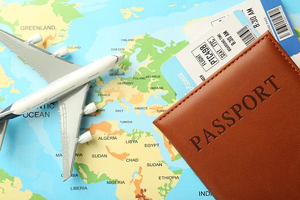 istock Passport with tickets and plane model on world map, top view 2246897096
