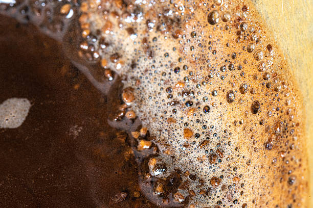 istock Studio shot of coffee grinds captured with controlled lighting for product or culinary design. 2246897674
