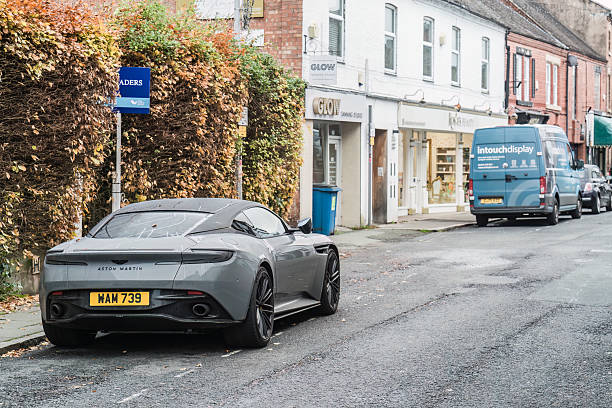 Nantwich, Cheshire, England, November 7th 2025. A gray Aston Martin DB12 is parked on a town street.