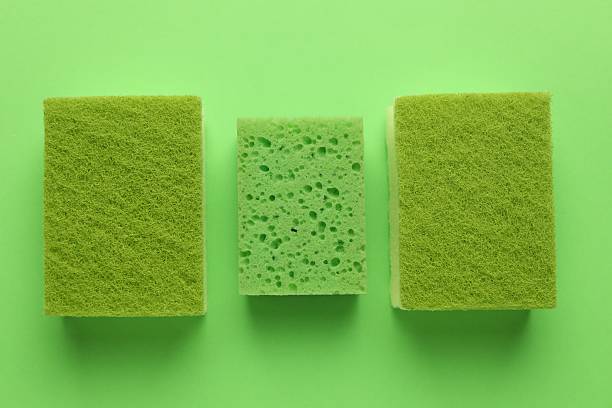 istock Group of sponges on green background, flat lay 2246897863