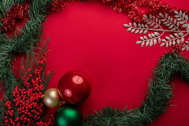 istock Festive Christmas decor on vibrant red background 2246900027