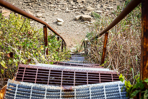 istock Old iron staircase leads to a river 2246901696