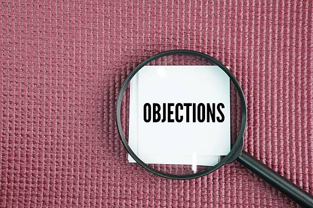 istock Magnifying glass with the word Objections 2246916502