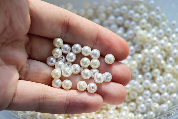 istock Beautiful white beads. Pearls. Bead texture and background. 2246917132