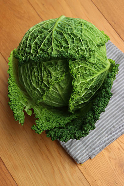 istock Brassica oleracea.  Savoy cabbage on gray napkin on  table 2246917664