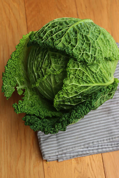 istock Brassica oleracea.  Savoy cabbage on gray napkin on  table 2246917687