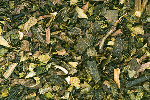 High-resolution detail of powdered matcha surface with visible micro-particles and natural color.