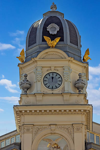 Ornate Clock Tower Building Against Blue Sky