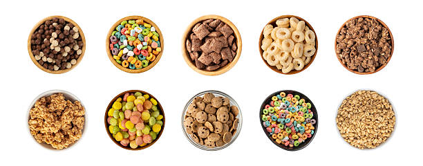 istock Assorted breakfast cereal piles isolated. Corn flakes mix, various granola food 2246921347