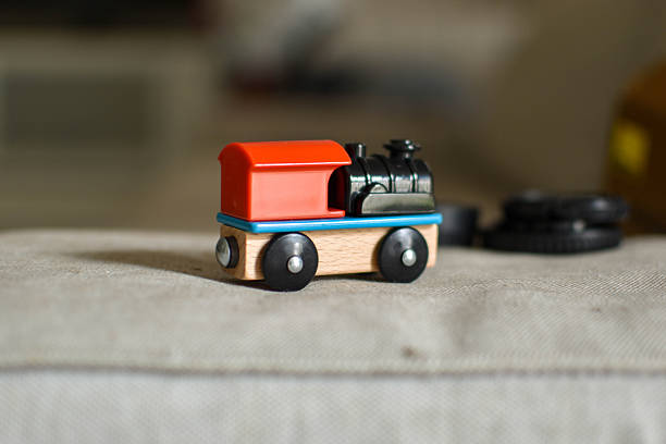 istock Wooden toy train with red roof and black engine 2246921432