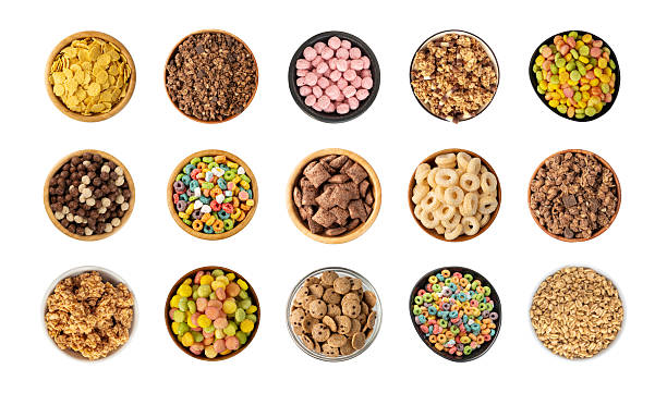 istock Assorted breakfast cereal piles isolated. Corn flakes mix, various granola food 2246921774