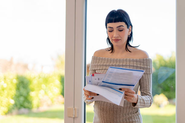 istock Woman reviewing important documents in a bright indoor setting 2246926916
