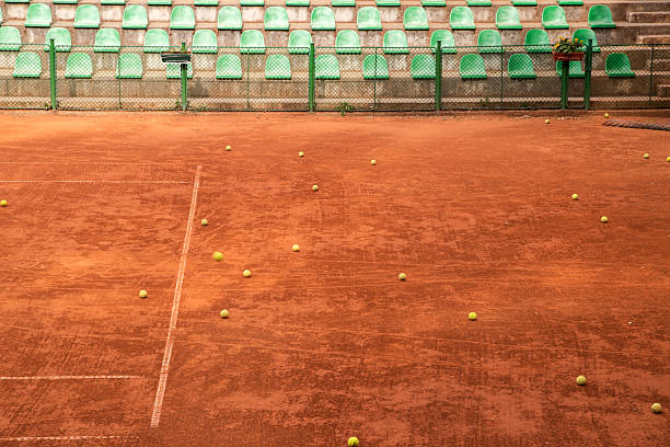 istock Scattered Tennis Balls on Clay 2246928249