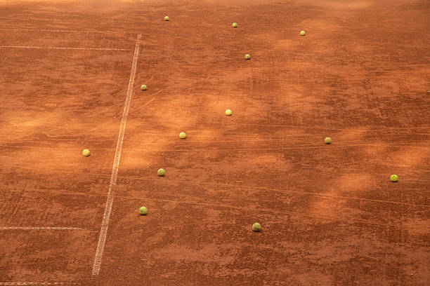 istock Scattered Tennis Balls on Clay 2246928345