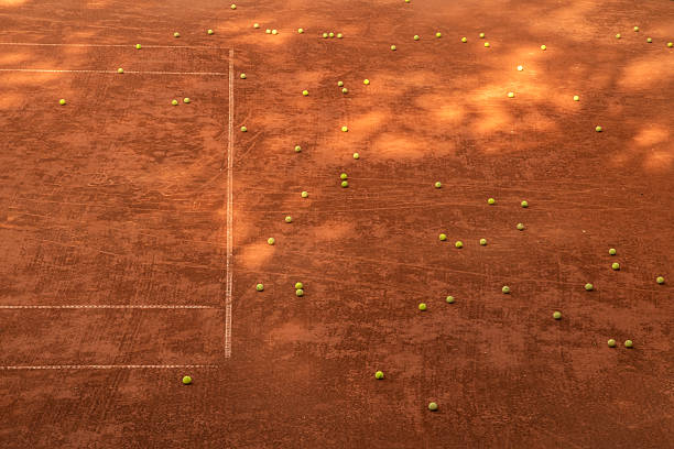 istock Scattered Tennis Balls on Clay 2246928358