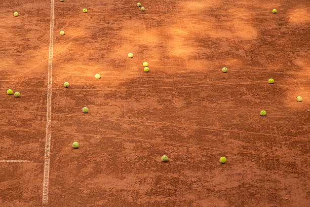 istock Scattered Tennis Balls on Clay 2246928438