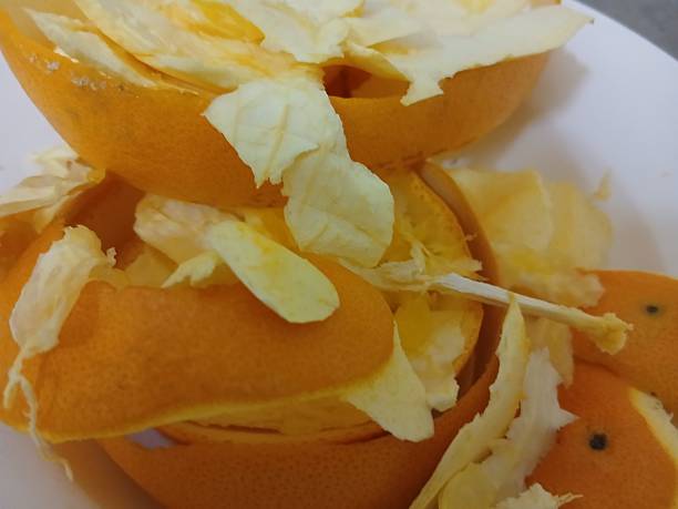 istock Orange peel on a white plate in the morning 2246929011