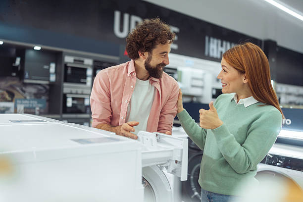 istock Happy Loving Couple Checking Washing Machine Detergent Dispenser 2246929112