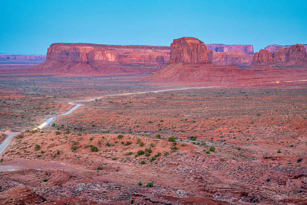 istock Panoramic Monument Valley desert under warm summer sunlight and vibrant blue sky above 2246931121