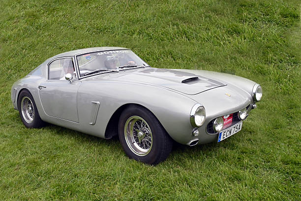 Stockholm, Sweden - June 04,2023: A fully restored FERRARI 330 GT 2+2  from 1964, in a classic car cavalcade around the small island Djurgarden on the public road in Stockholm Sweden.