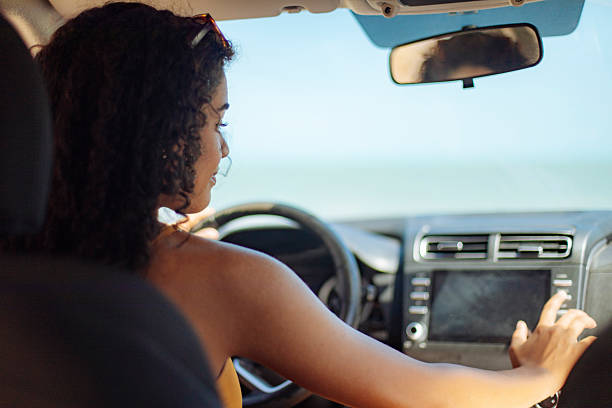 istock Smiling young woman driving on a sunny day 2246932845