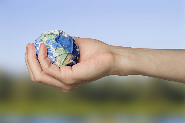 istock Planet Earth in the hands of garbage pollution ecology 2246935324