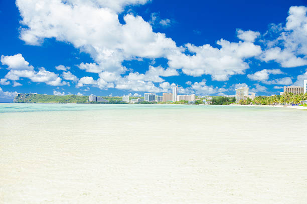 Quiet tropical beach with crystal clear water, Guam island,