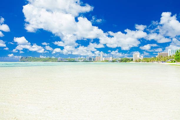Quiet tropical beach with crystal clear water, Guam island,