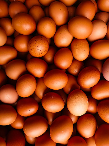 istock A dense, overhead shot of many brown chicken eggs filling the frame, creating a textured, organic pattern. 2246938813