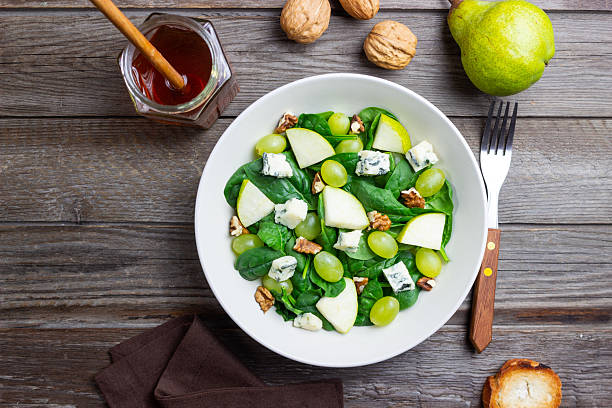 istock Salad with spinach, blue cheese, pear, grapes, and nuts. Healthy eating. Vegetarian. 2246941475