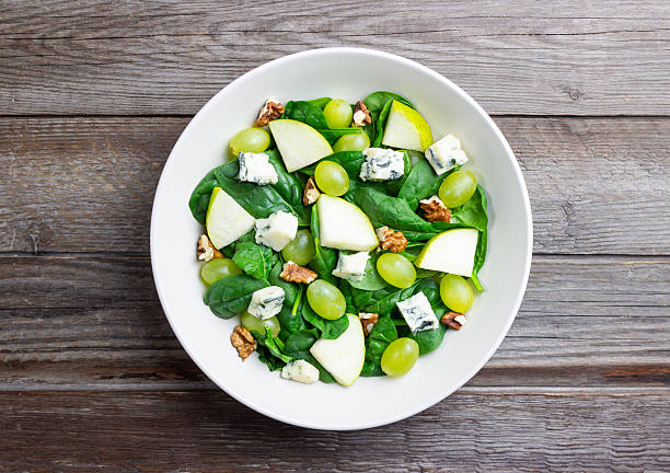 istock Salad with spinach, blue cheese, pear, grapes, and nuts. Healthy eating. Vegetarian. 2246941476