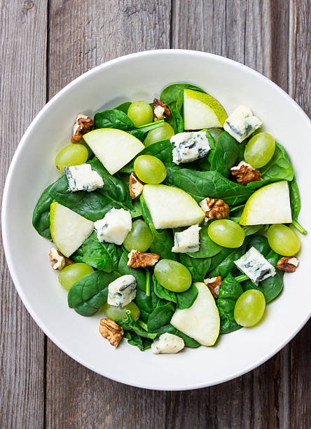 istock Salad with spinach, blue cheese, pear, grapes, and nuts. Healthy eating. Vegetarian. 2246941477