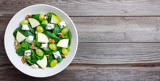 istock Salad with spinach, blue cheese, pear, grapes, and nuts. Healthy eating. Vegetarian. 2246941479