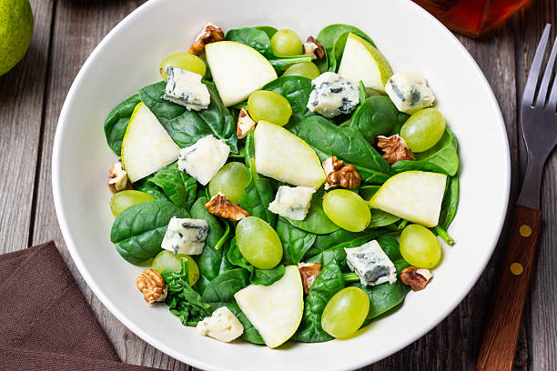 istock Salad with spinach, blue cheese, pear, grapes, and nuts. Healthy eating. Vegetarian. 2246941487