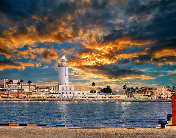istock View of the Malaga lighthouse with a spectacular sunset. 2246944135