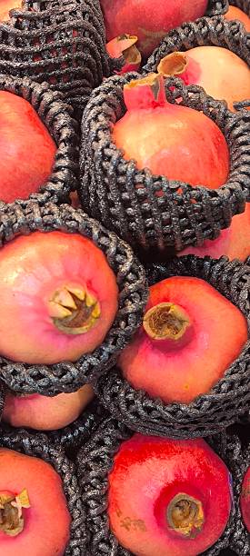istock Red pomegranates in a fruit shop 2246949460