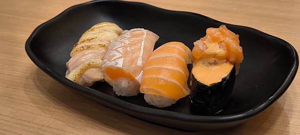istock Sushi on a black plate Japanese food 2246951002