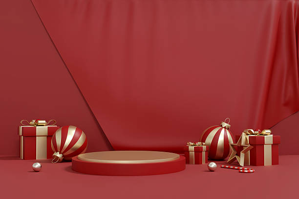 istock Red and Gold Christmas Gift Boxes and Ornaments on Minimal Podium 2246951414